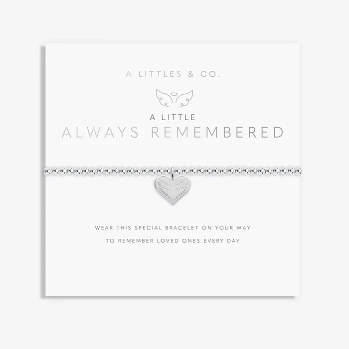 A Littles & Co Always Remembered bracelet displayed on sentiment card featuring silver heart charm with angel wings