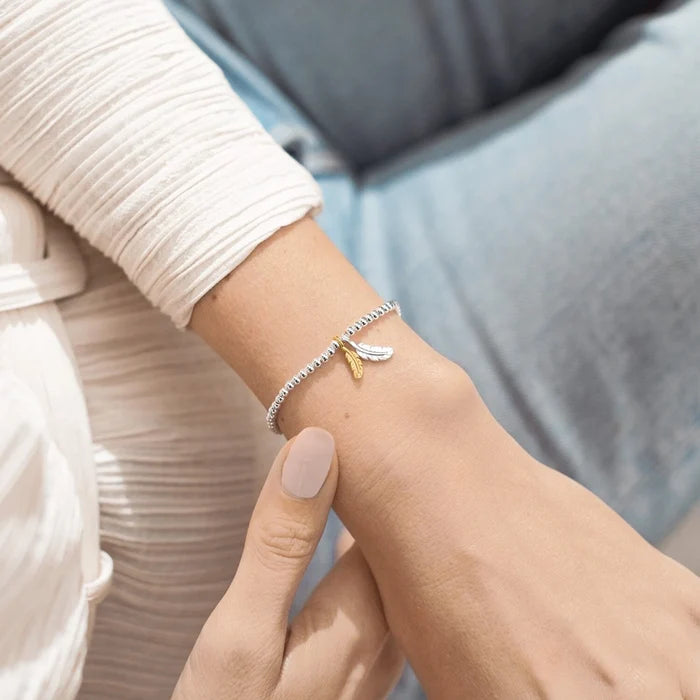 This A Littles & Co A Little 'Feathers' Bracelet offers a sweet way to remember someone special.