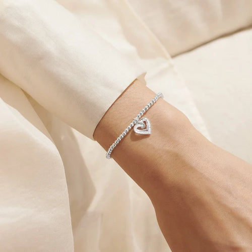 A Littles & Co. A Little Forever Thankful bracelet worn on wrist with silver beaded design and heart charm, friendship gift jewellery