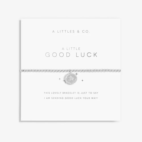 A Littles & Co. A Little Good Luck Bracelet on sentiment card with silver star charm