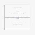 A Littles & Co. A Little I Love You bracelet with silver beaded stretch band and three heart charms on keepsake card
