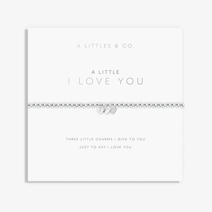 A Littles & Co. A Little I Love You bracelet with silver beaded stretch band and three heart charms on keepsake card