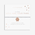 Card with a paw print charm and text about love having four paws, branded 'A Littles & Co'.