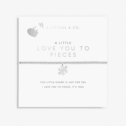 Jewelry set with puzzle piece charm on a white background, featuring 'A Littles & Co.' branding.
