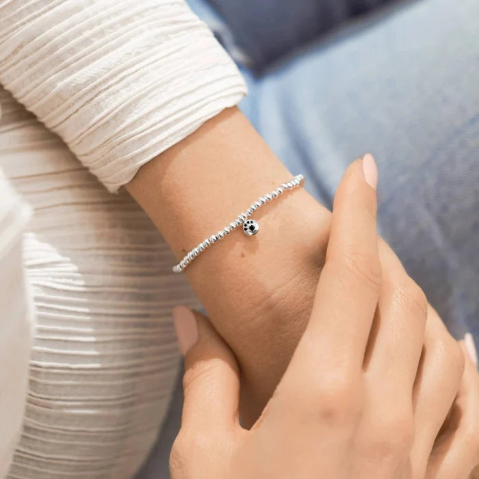 A Little Paw Print Bracelet featuring a charming paw print design, perfect for pet lovers.