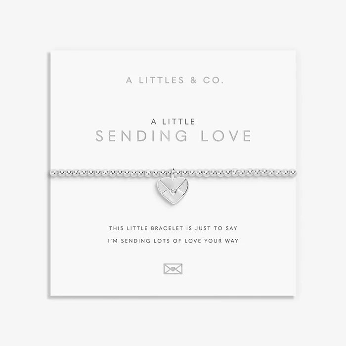 A Littles & Co. A Little Sending Love bracelet on sentiment card with silver heart envelope charm