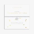 A Littles & Co A Little Thinking Of You bracelet displayed on sentiment card with silver flower charm and beaded design