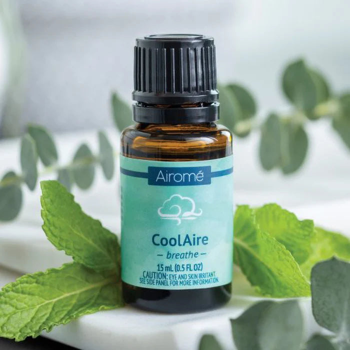 Airome CoolAire essential oil bottle with eucalyptus leaves on a light background