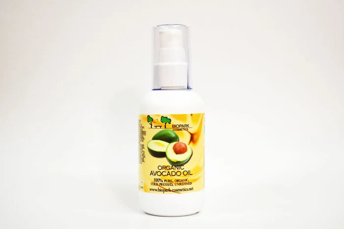 Bottle of organic avocado oil with a label on a white background