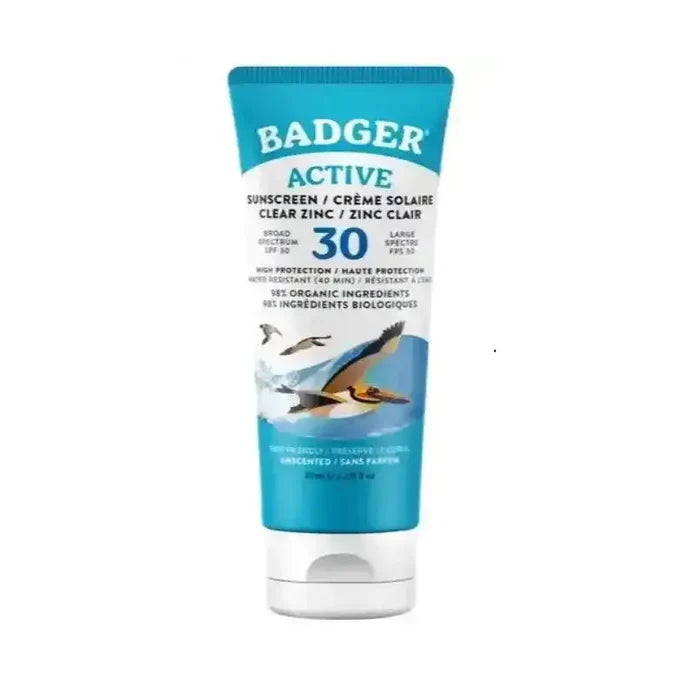 A tube of Badger Active sunscreen with a blue and white design, featuring illustrations of badgers and a badger on the front, with SPF 30 text prominently displayed.