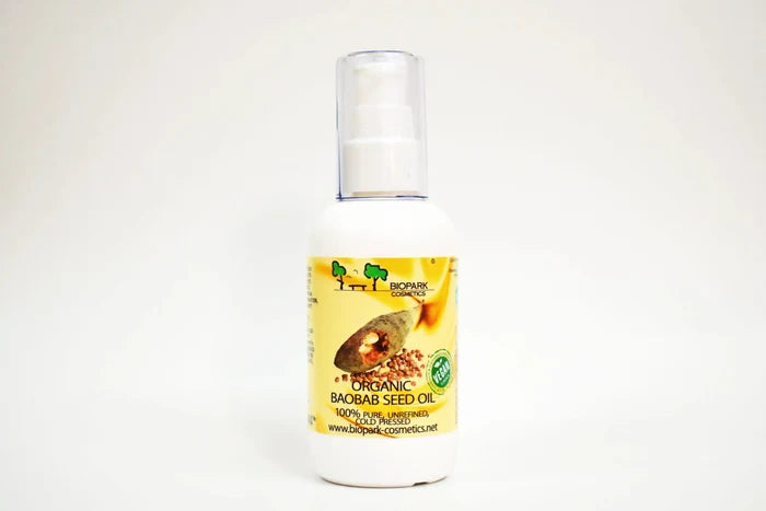Bottle of organic baobab seed oil with a yellow label on a white background