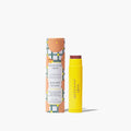 Lip balm tube featuring a bright yellow and green label, showcasing its vibrant packaging design.
