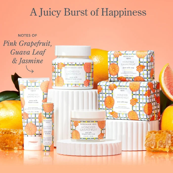 A vibrant grapefruit half with honey, emphasizing the sweet and tangy aroma of the honeyed grapefruit scent.