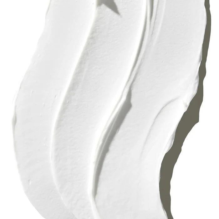 A jar of pure face cream featuring a white lid, emphasizing its simplicity and elegance.