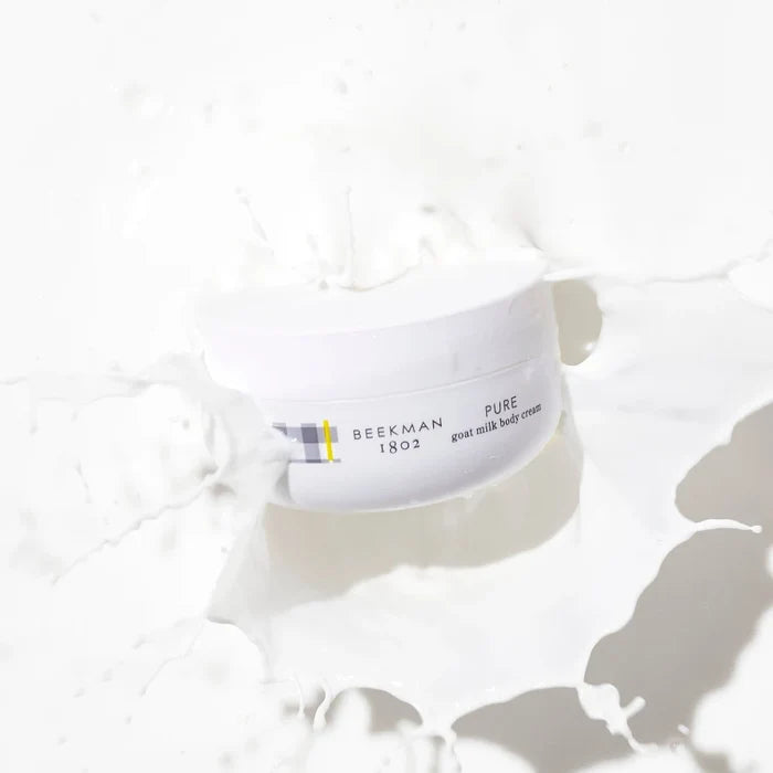 Pure face cream container with a white lid, highlighting its clean and minimalist design.