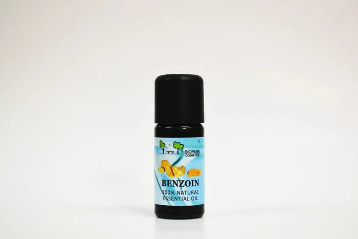 Bottle of benzoin essential oil on a white background