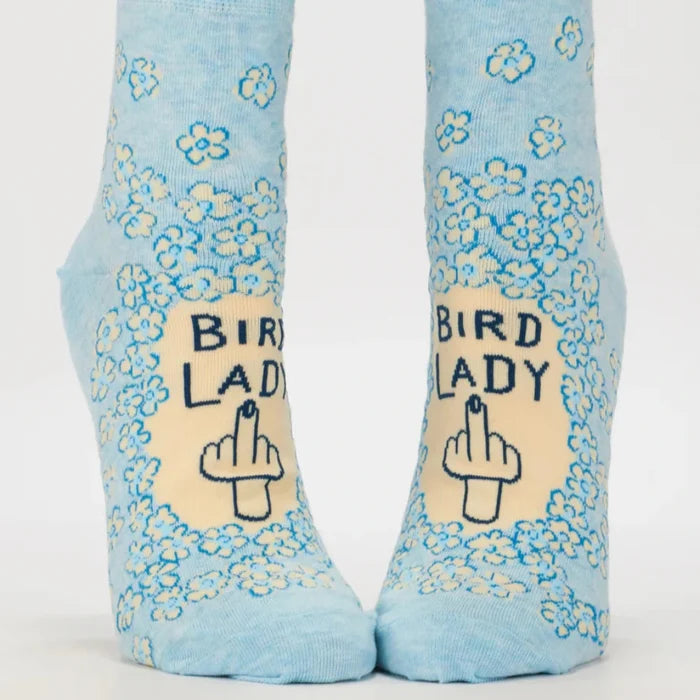 Light blue socks with floral patterns and 'Bird Lady' text on a white background