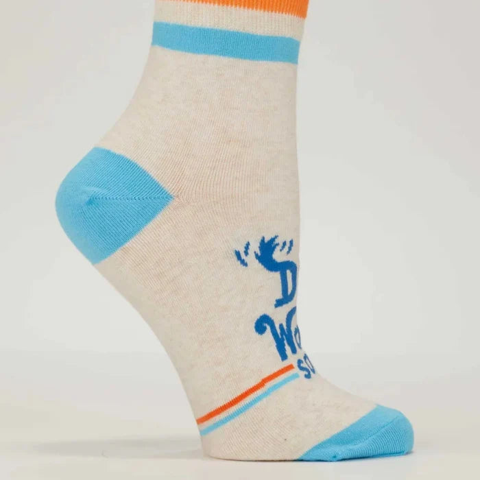 Beige ankle sock with blue and orange accents on a light gray background