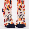 Pair of socks with colorful design and text on a white background