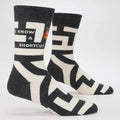 Black and white socks with geometric pattern on a white background