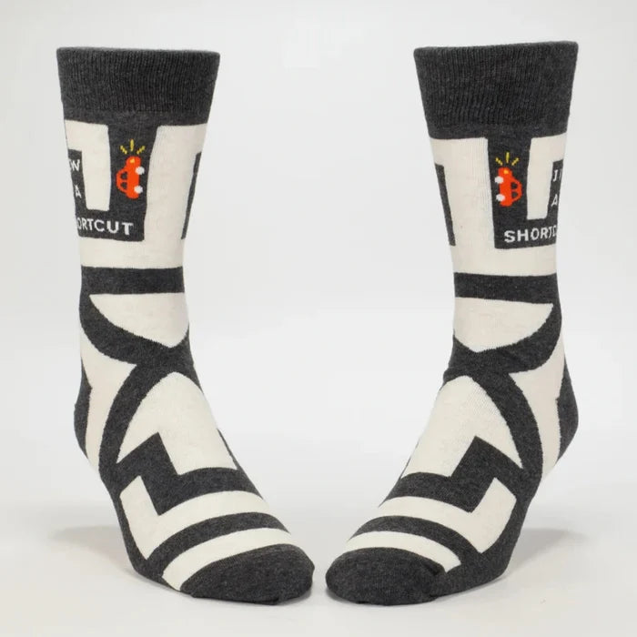 Pair of black and white socks with geometric pattern on a white background