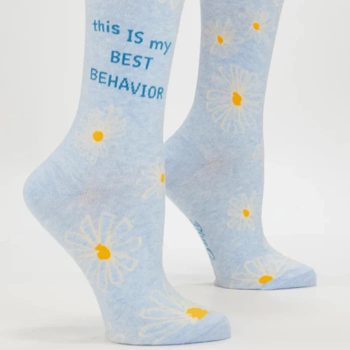 Light blue socks with daisy flowers and text on a white background