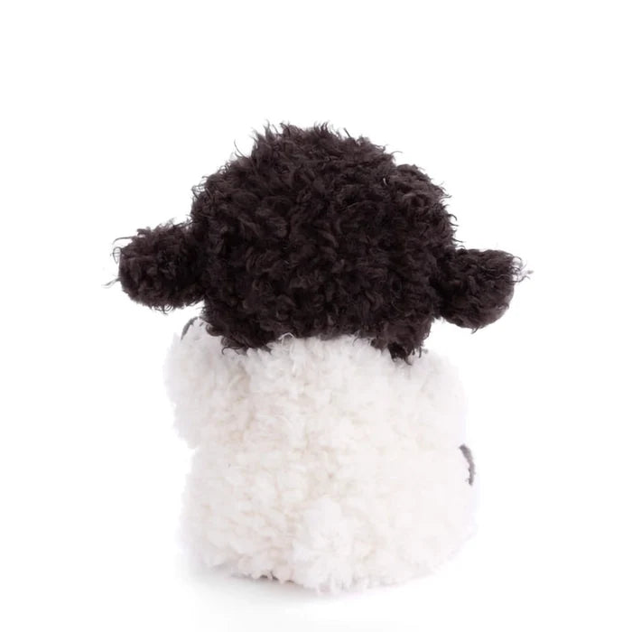 Back view of Bukowski Black Sheep plush showing soft white fleece body and curly black head