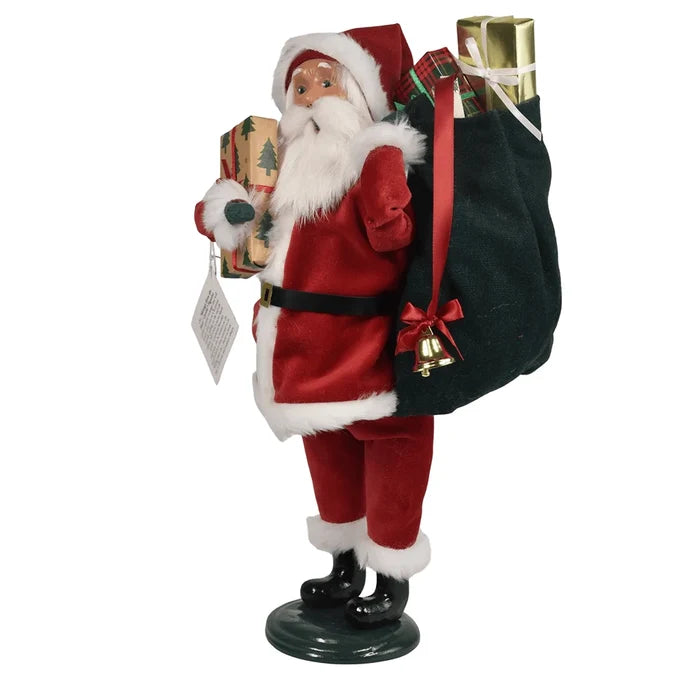 Right side of Byers' Decorative figure of Santa Claus holding gifts and a sack on a white background.