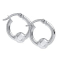 These stunning hoops feature a signature ball detail that adds dimension and visual interest.