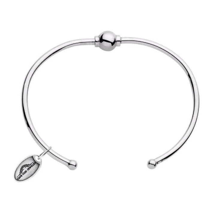 Silver bracelet with a small tag on a white background