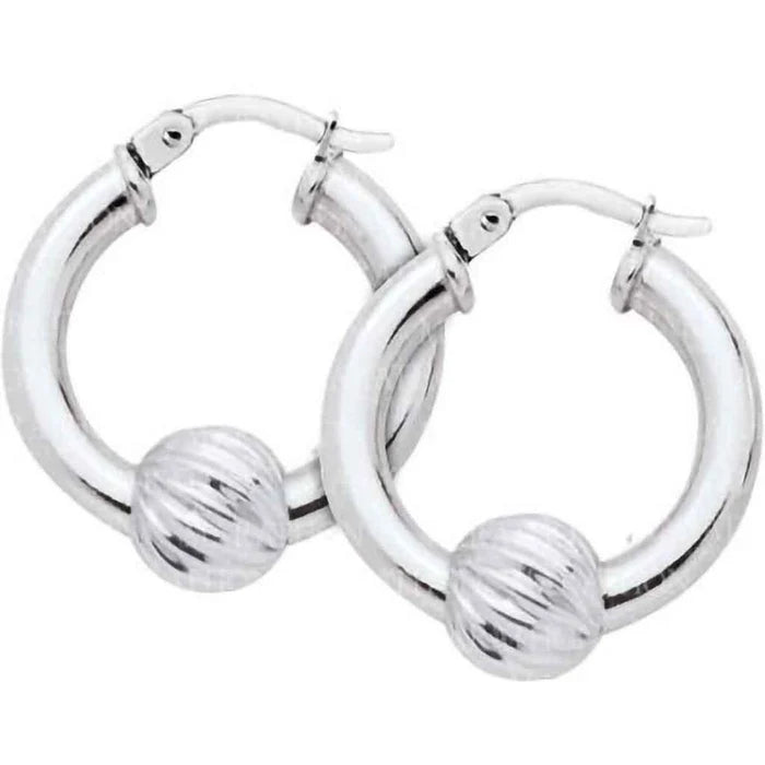 Silver hoop earrings with ball accents on a white background