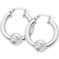 Silver hoop earrings with ball accents on a white background