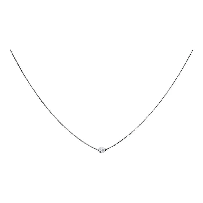 Delicate necklace with a small diamond pendant on a white background