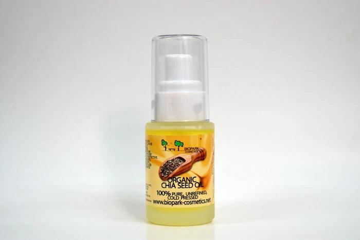 Bottle of organic chia seed oil with a white background