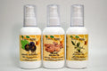 Three bottles of organic oils with visible labels on a gray background