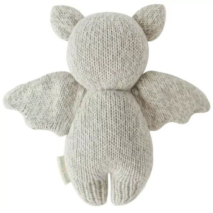 Back view of Cuddle + Kind Baby Bat in Grey – handmade knit stuffed animal with wings and ears.