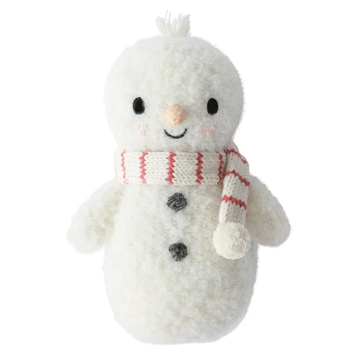 Front view of baby snowman doll with embroidered eyes, peach carrot nose, black buttons, and candy cane scarf.