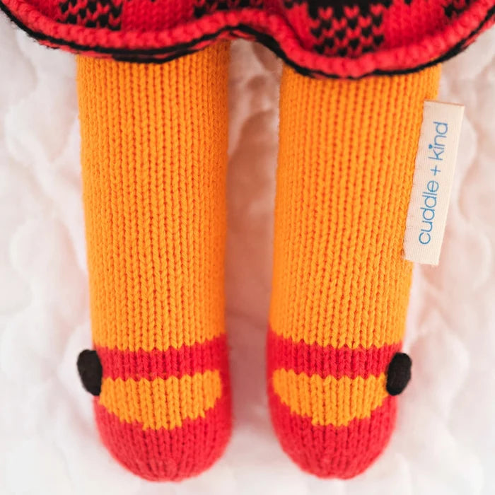 Close-up of Sadie the Fox’s knit legs with orange, red, and black details – Cuddle + Kind hand-knit doll