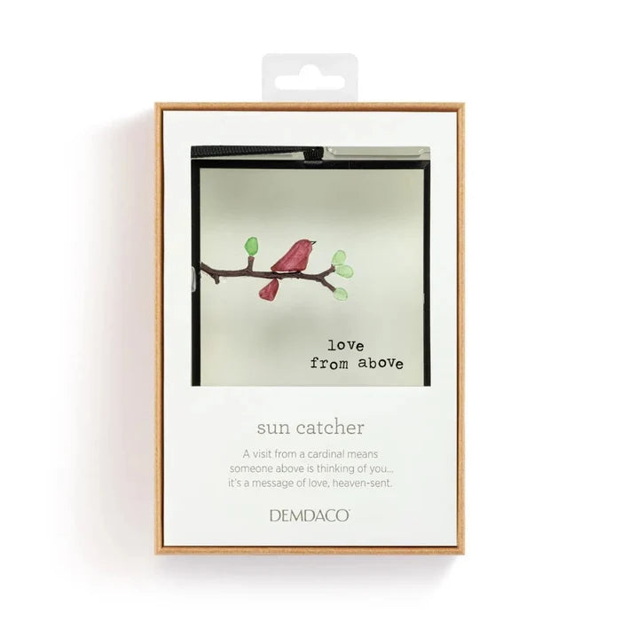Packaged sun catcher with bird illustration and text on a white background