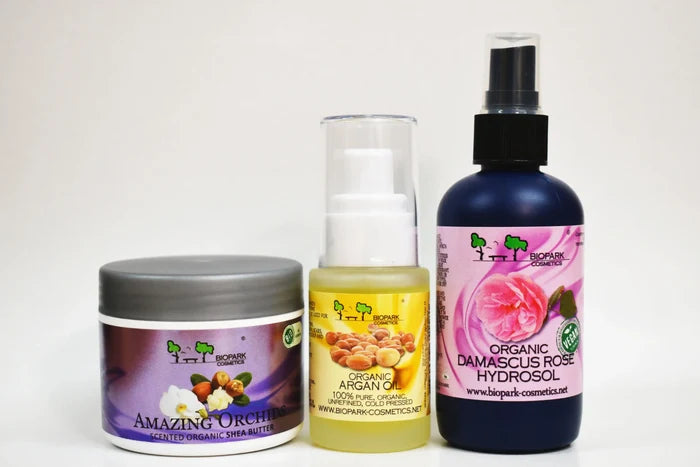 Four organic cosmetic products on a white background