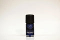 Bottle of Elite Oils Bergamot essential oil on a white background