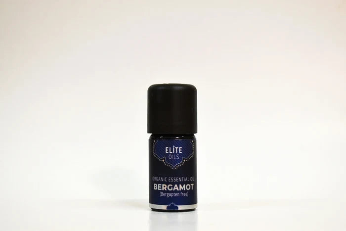 Bottle of Elite Oils Bergamot essential oil on a white background