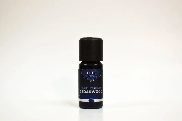 Bottle of Elite Oils Cedarwood essential oil on a white background