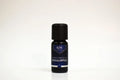 Bottle of Eucalyptus essential oil with a black cap on a white background