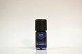 Bottle of Elite Oils Fir Needle essential oil on a white background
