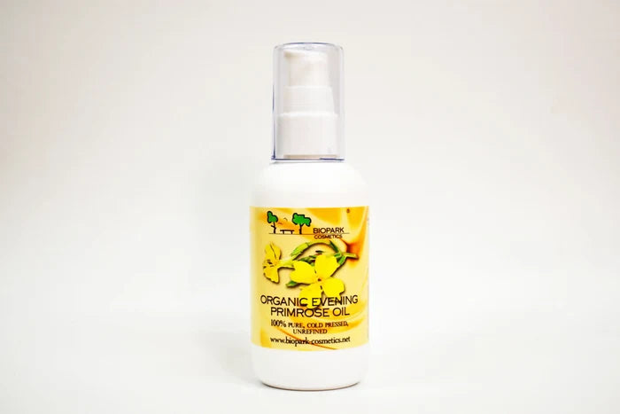 Bottle of organic evening primrose oil with a yellow label on a white background
