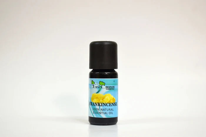Essential oil bottle labeled 'Frankincense' on a white background