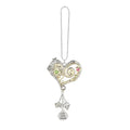 Heart-shaped pendant with charms on a white background