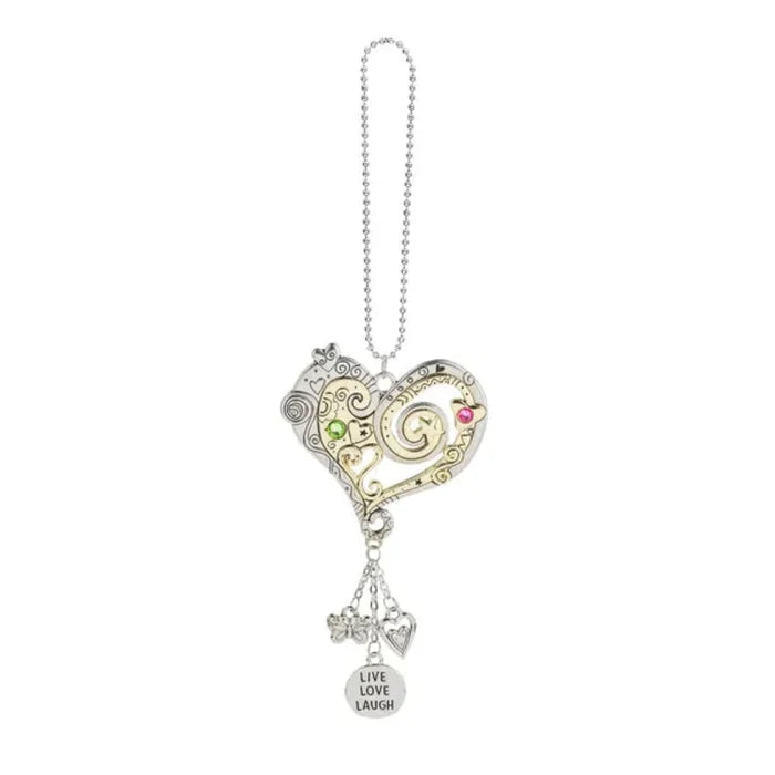 Heart-shaped pendant with charms on a white background