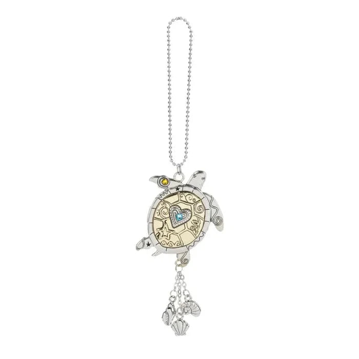 Silver turtle-shaped keychain with heart design on a white background